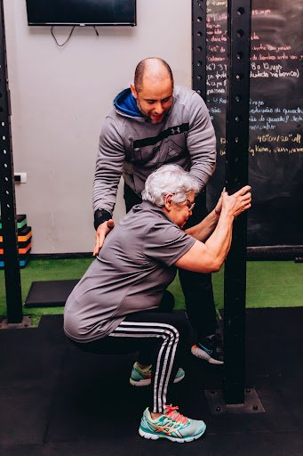older woman doing a squat