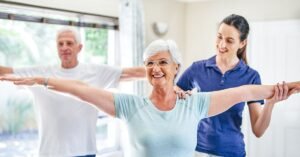 senior man and woman doing balance exercises with a personal trainer